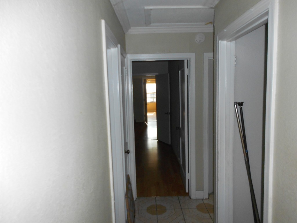 1423 Berene Avenue Austin, TX 78721 - Photo 14 of 24 a view of a hallway with wooden floor and stairs