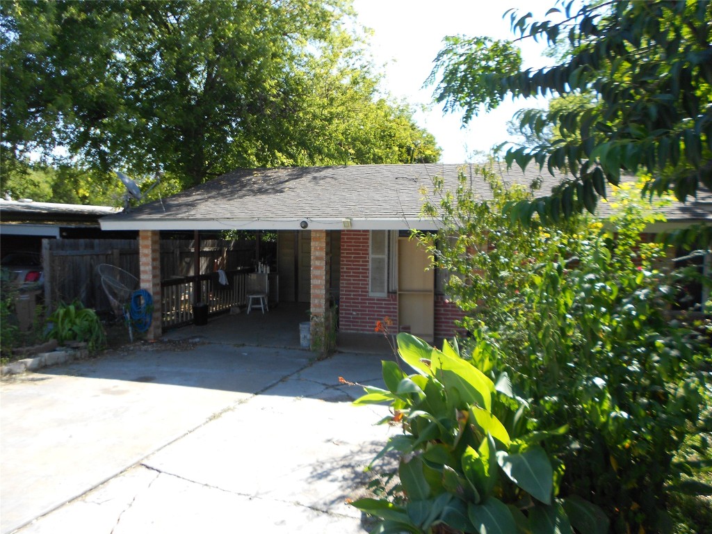 1423 Berene Avenue Austin, TX 78721 - Photo 2 of 24 a view of a house with a small yard and plant
