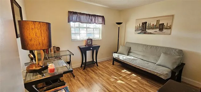 a living room with furniture and a window