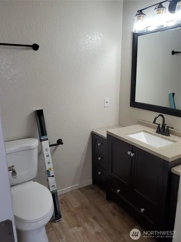 a kitchen with stainless steel appliances granite countertop a sink and a stove