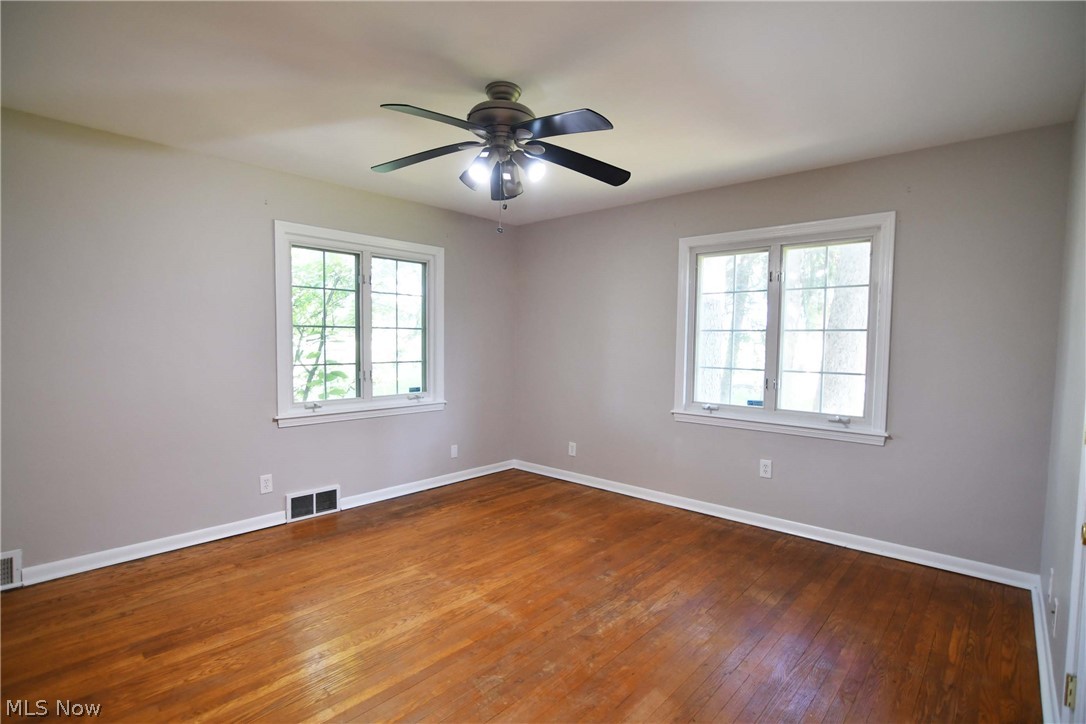 197 North Medina Line Road Akron, OH 44333 - Photo 24 of 35 LARGE BEDROOM WITH AN ABUNDANCE OF LIGHT, HARDWOOD AND WALK IN CLOSET