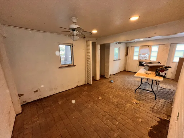 a view of a livingroom with furniture and a window