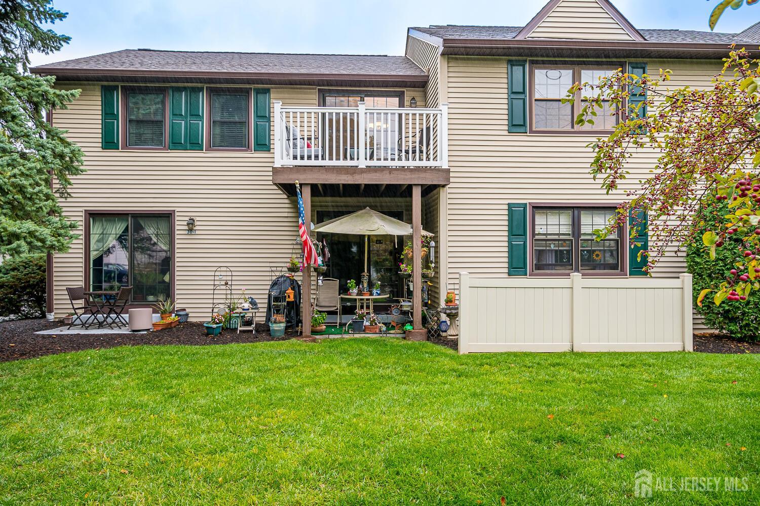 30-5 Prospect Street, Unit 2 Metuchen, NJ 08840 - Photo 21 of 23 a front view of a house with a yard and garage