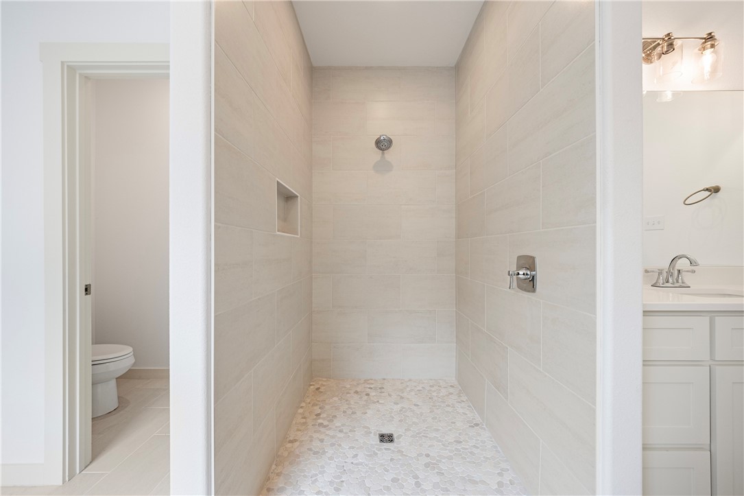 1702 Elm View Drive Corpus Christi, TX 78418 - Photo 14 of 27 a bathroom with a sink and toilet