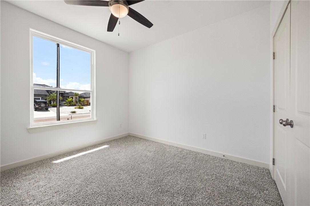 1702 Elm View Drive Corpus Christi, TX 78418 - Photo 17 of 27 a view of an empty room with a window
