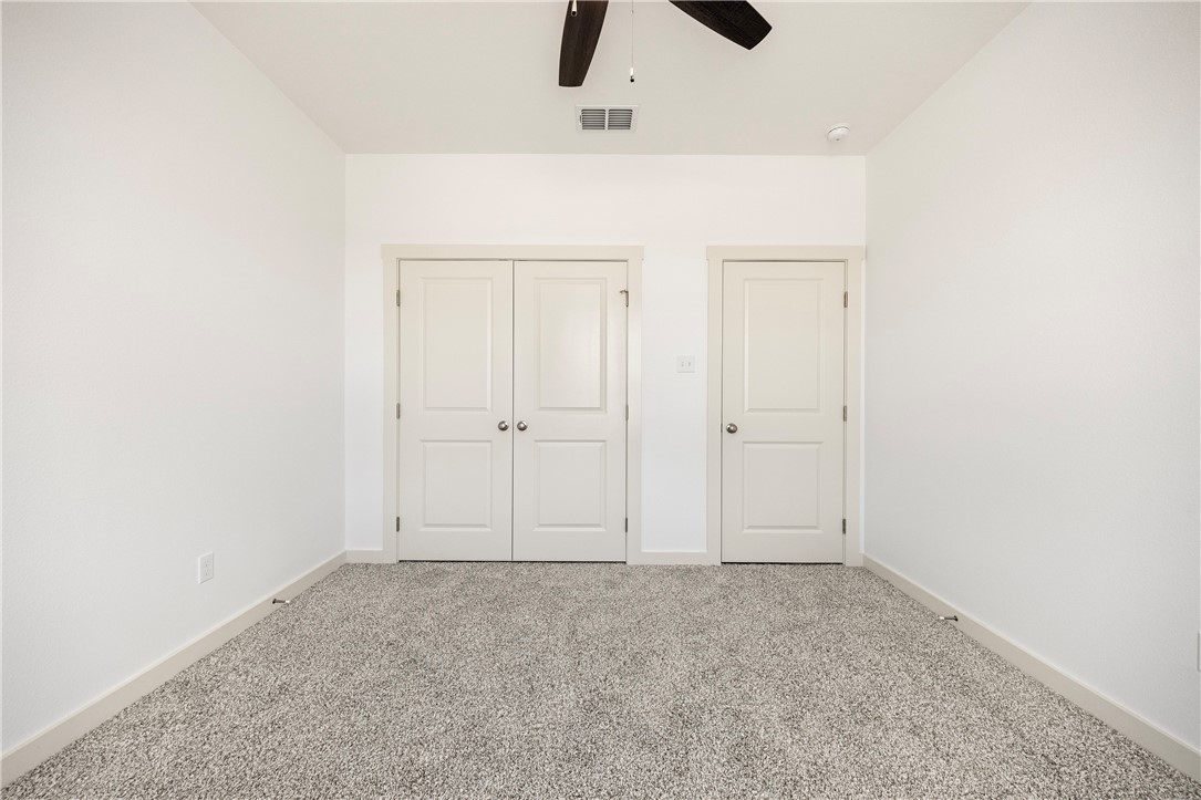 1702 Elm View Drive Corpus Christi, TX 78418 - Photo 18 of 27 an empty room with cabinet