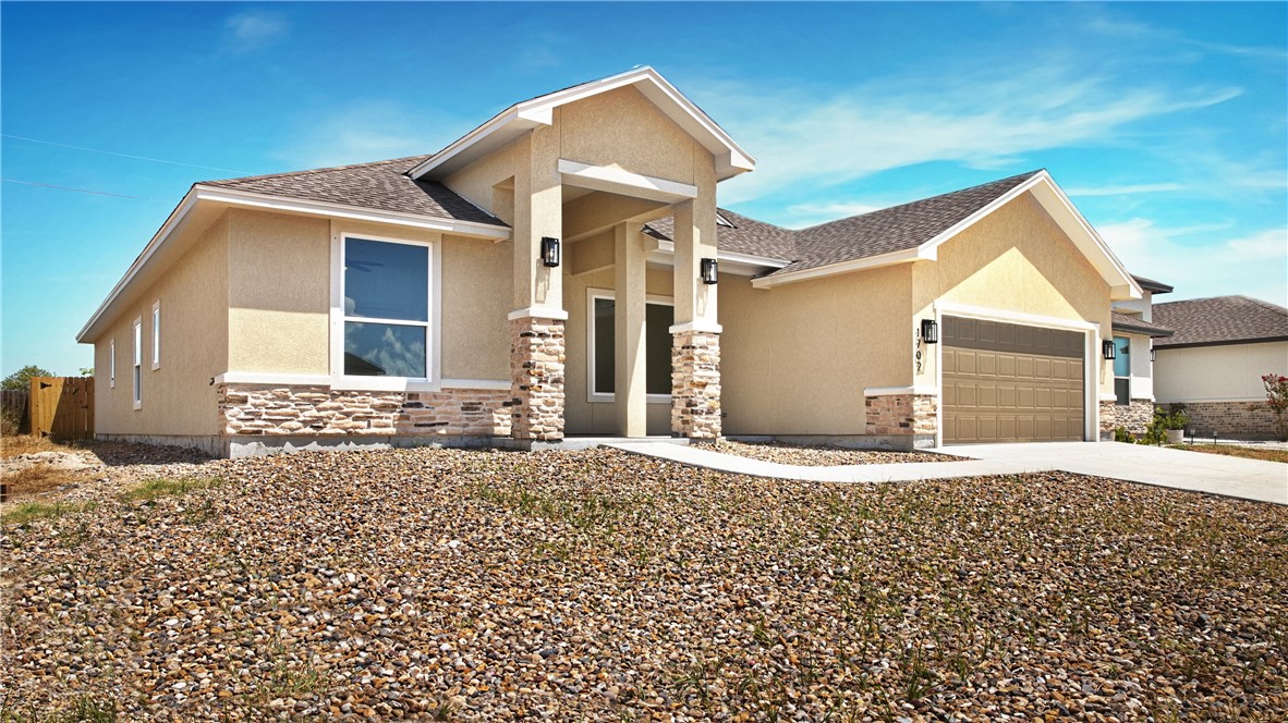 1702 Elm View Drive Corpus Christi, TX 78418 - Photo 2 of 27 a front view of a house with a yard