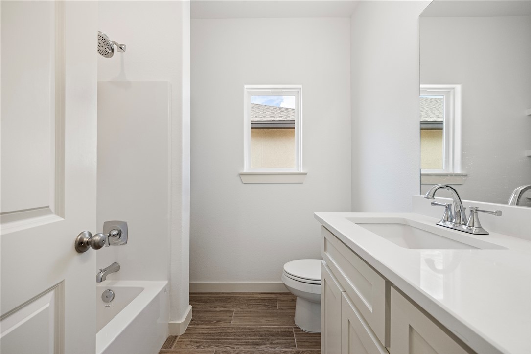 1702 Elm View Drive Corpus Christi, TX 78418 - Photo 23 of 27 a bathroom with a sink and a bathtub