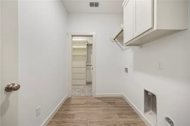 a view of a hallway with closet
