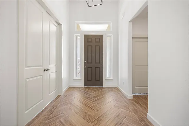 a view of a livingroom with wooden floor and closet