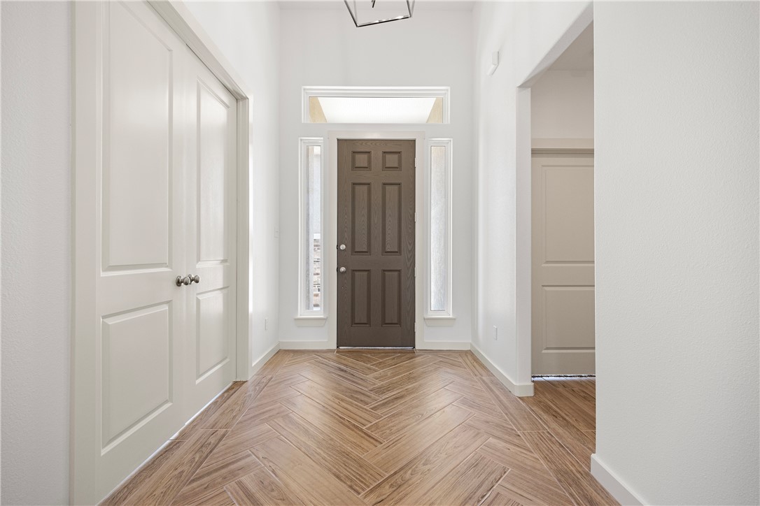 1702 Elm View Drive Corpus Christi, TX 78418 - Photo 4 of 27 a view of a livingroom with wooden floor and closet