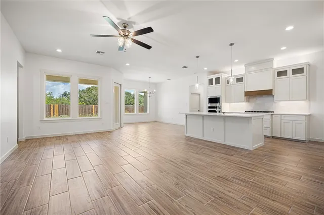 a view of kitchen with cabinets and wooden floor