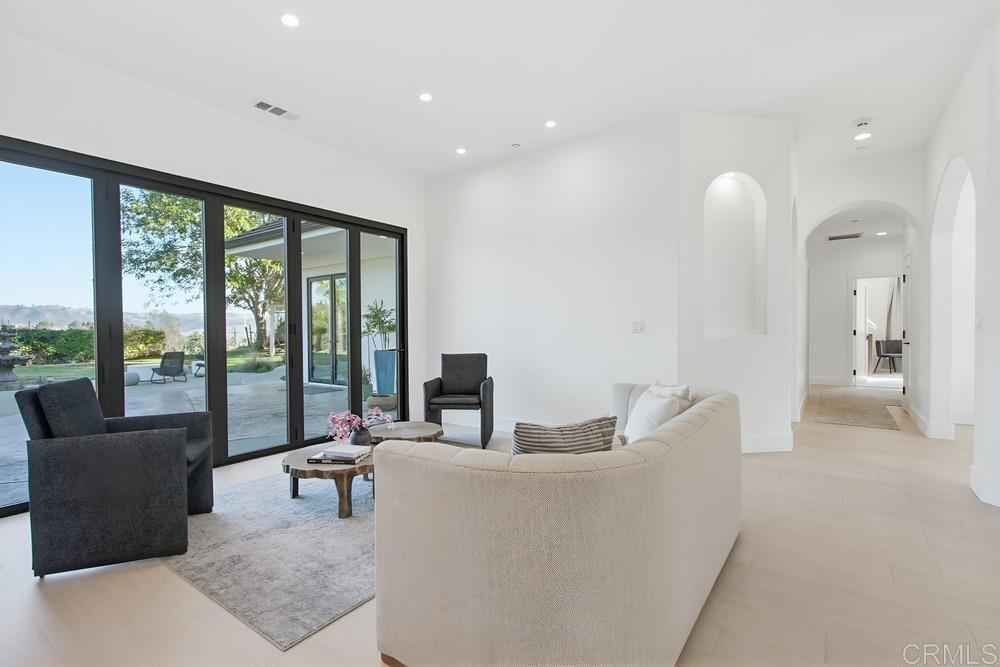2241 Via Corto Fallbrook, CA 92028 - Photo 14 of 66 a living room with furniture and large windows