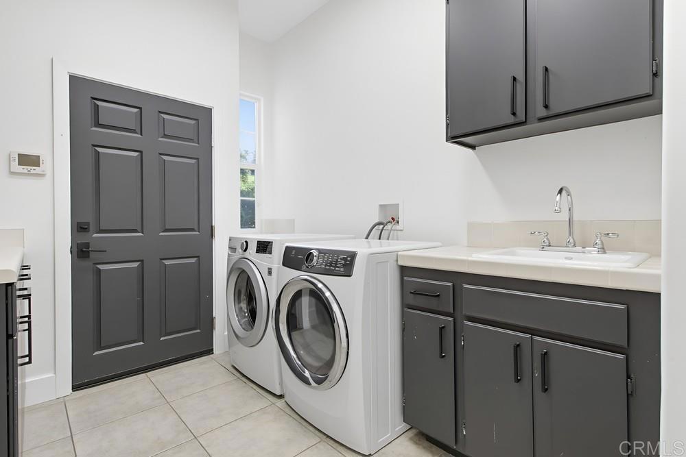2241 Via Corto Fallbrook, CA 92028 - Photo 29 of 66 a utility room with dryer and washer
