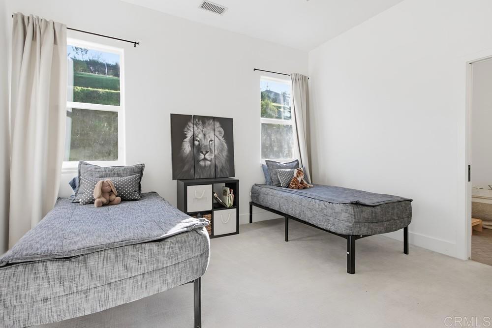 2241 Via Corto Fallbrook, CA 92028 - Photo 46 of 66 a bedroom with a bed and a window