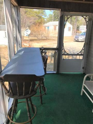 262 Old Wharf Road, Unit 67 Dennis Port, MA 02639 - Photo 17 of 28 a view of a room with furniture and a window