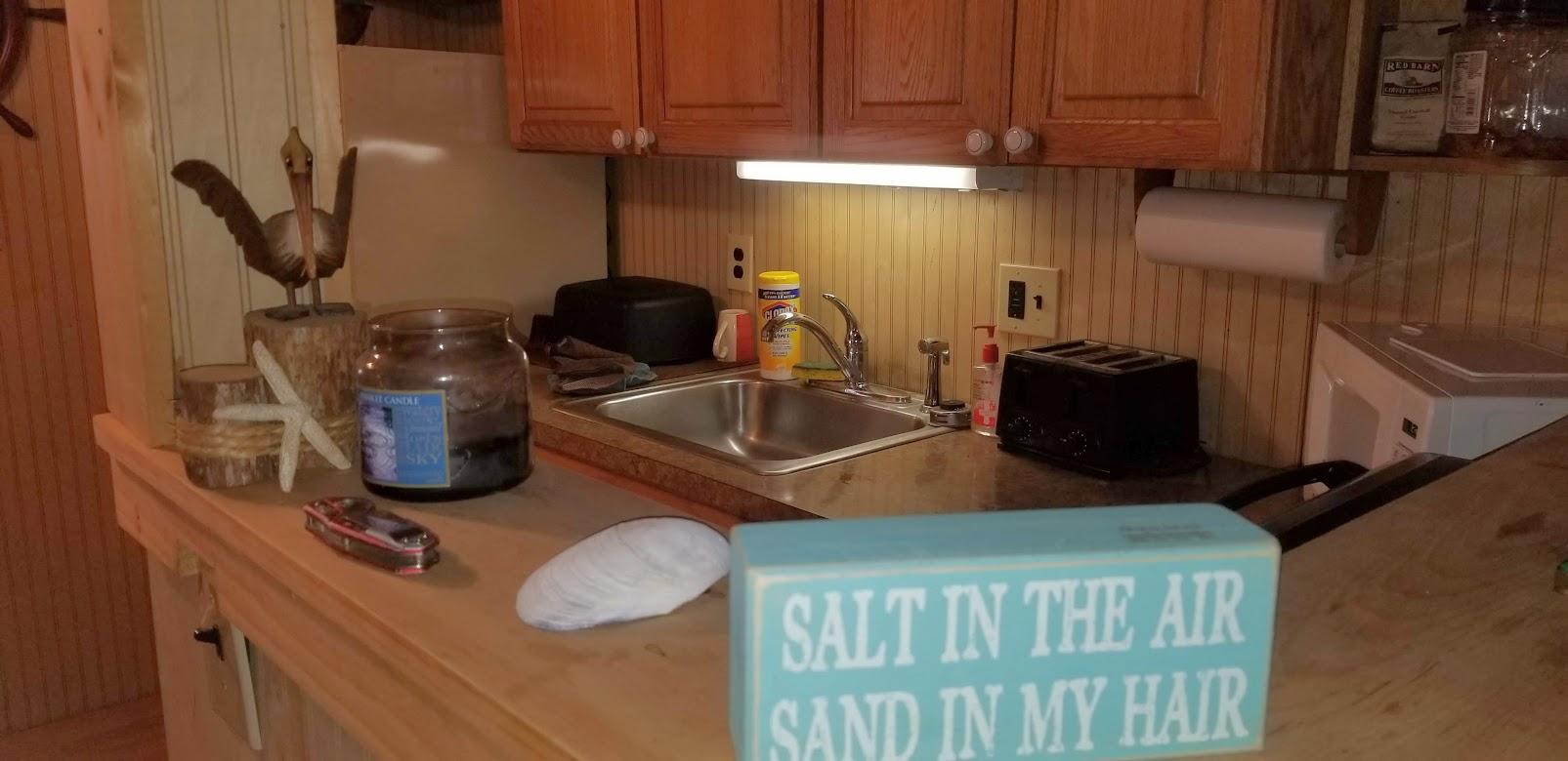 262 Old Wharf Road, Unit 67 Dennis Port, MA 02639 - Photo 2 of 28 a kitchen with a refrigerator and a sink