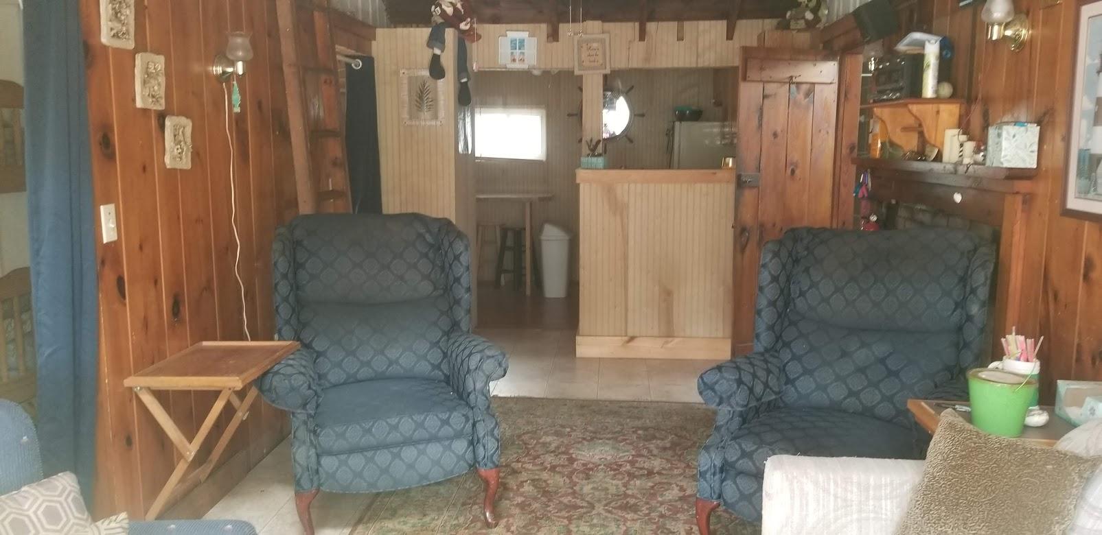 262 Old Wharf Road, Unit 67 Dennis Port, MA 02639 - Photo 7 of 28 a living room with furniture and a fireplace