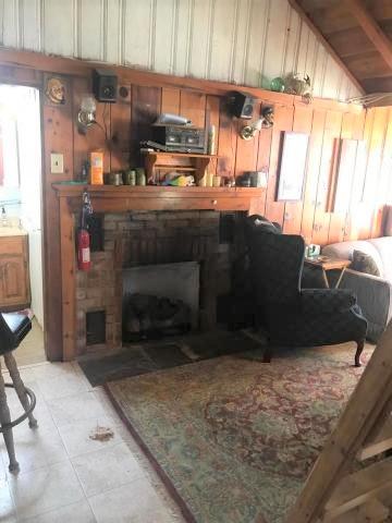 262 Old Wharf Road, Unit 67 Dennis Port, MA 02639 - Photo 8 of 28 a kitchen with granite countertop a stove a sink and a refrigerator