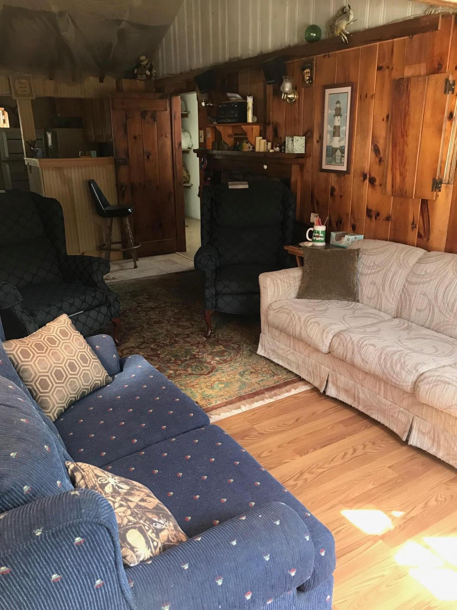 262 Old Wharf Road, Unit 67 Dennis Port, MA 02639 - Photo 10 of 28 a living room with couches and kitchen view