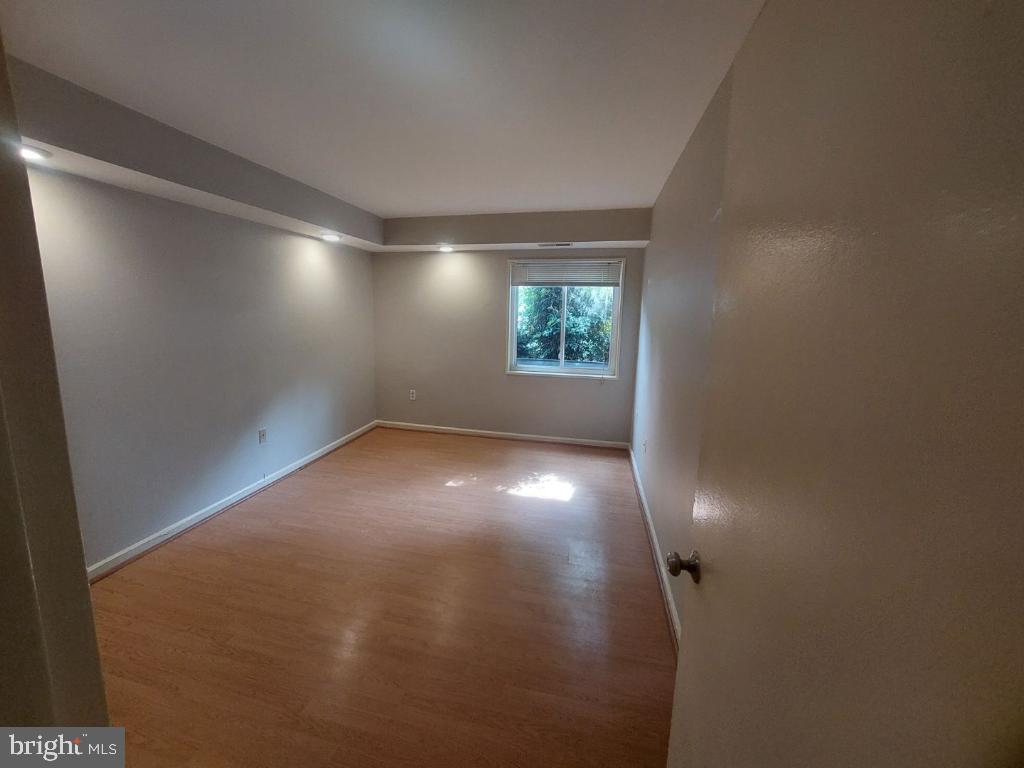 1523 Northgate Square, Unit 15231B Reston, VA 20190 - Photo 8 of 12 an empty room with windows