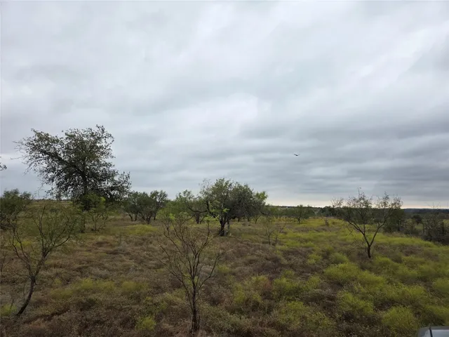 a view of a town with mountains in the background