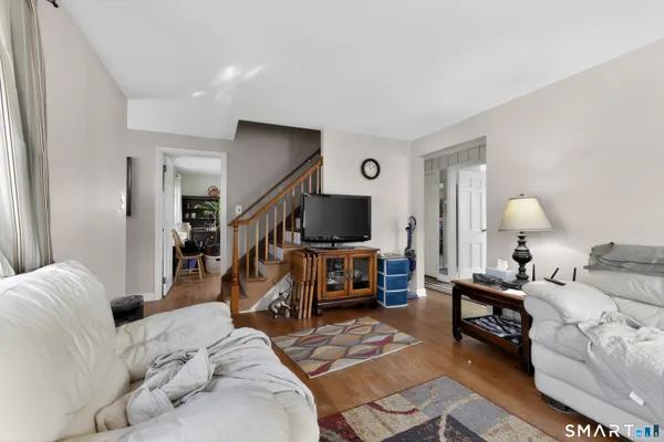 a living room with furniture and a flat screen tv