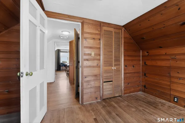 a view of walk in closet with clothes