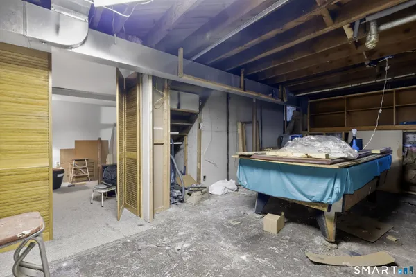 a view of a room with table and chairs