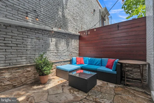 a outdoor living space with patio furniture and a potted plant