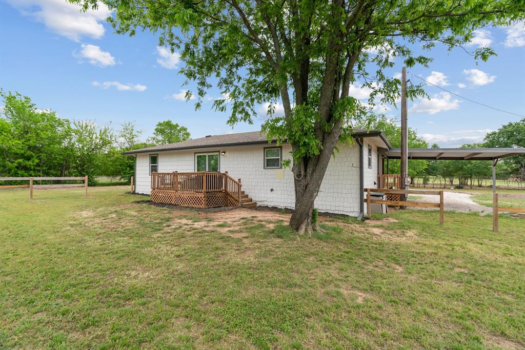 360 County Road 4358 Decatur, TX 76234 - Photo 27 of 38 Rear view of property with a yard, fence, and a deck