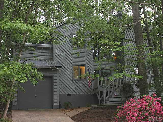 22 Sandstone Ridge Drive Durham, NC 27713 - Photo 1 of 16 a front view of a house with plants