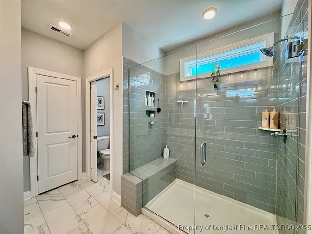 a bathroom with a double vanity sink mirror and a