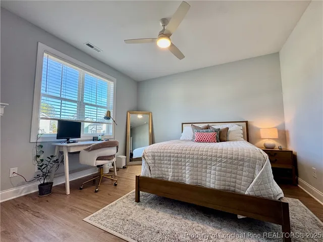 a bedroom with furniture and a window