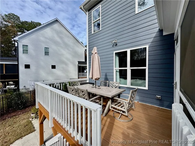 a view of outdoor space with deck and tree