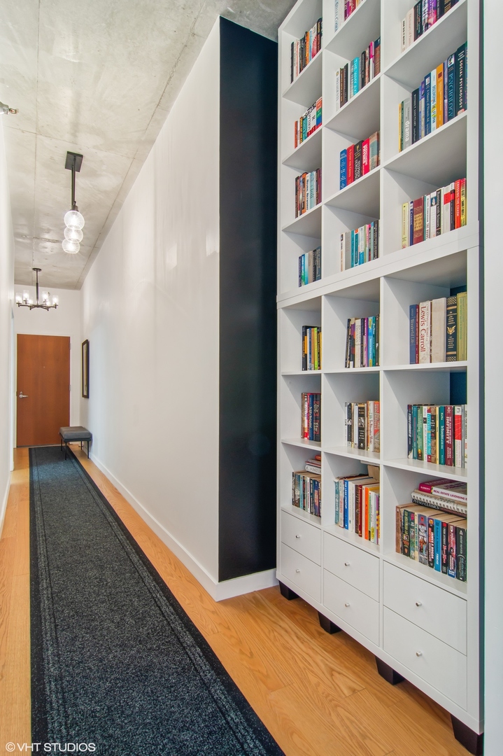 235 West Van Buren Street, Unit 1815 Chicago, IL 60607 - Photo 11 of 17 a room with a book shelf and a book shelf