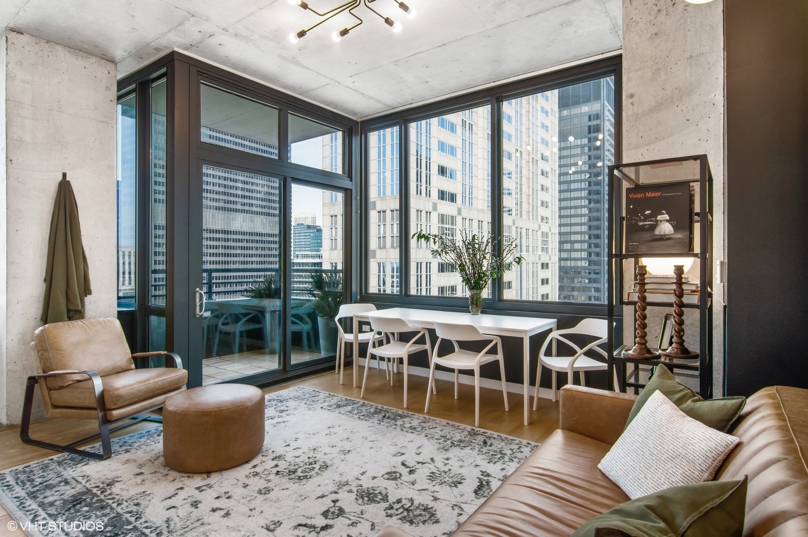 235 West Van Buren Street, Unit 1815 Chicago, IL 60607 - Photo 2 of 17 a living room with furniture and a large window