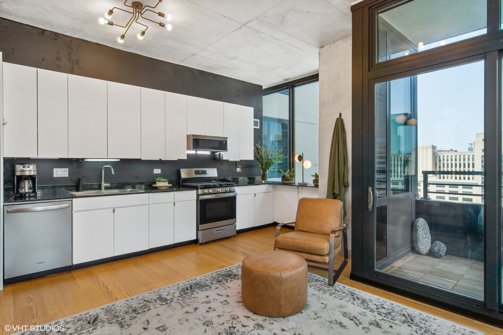 235 West Van Buren Street, Unit 1815 Chicago, IL 60607 - Photo 5 of 17 a kitchen with a sink cabinets and stainless steel appliances
