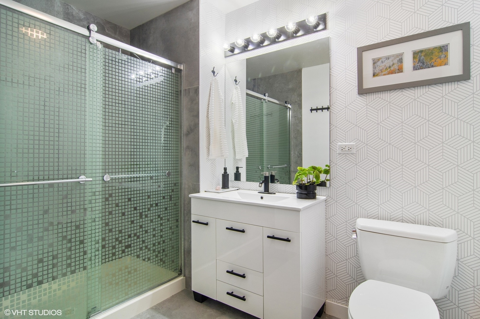 235 West Van Buren Street, Unit 1815 Chicago, IL 60607 - Photo 10 of 17 a bathroom with a sink a toilet and shower