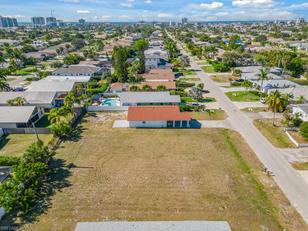 686 97th Avenue North Naples, FL 34108 - Photo 1 of 24 an aerial view of residential houses with outdoor space