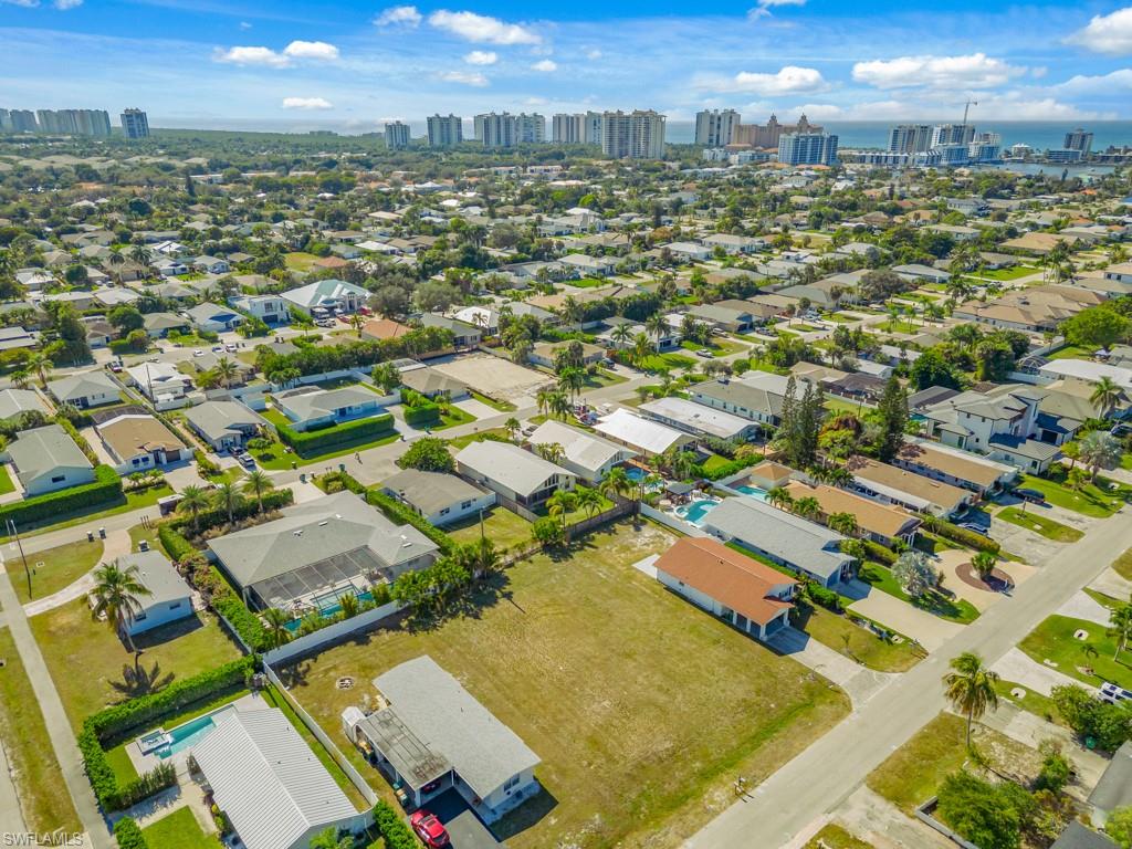 686 97th Avenue North Naples, FL 34108 - Photo 12 of 24 an aerial view of residential houses with outdoor space