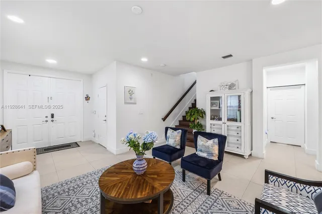 a living room with furniture and a rug