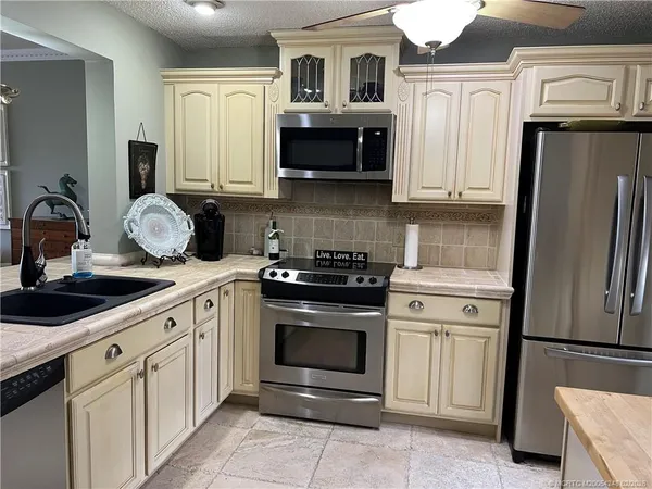 a kitchen with a table and chairs