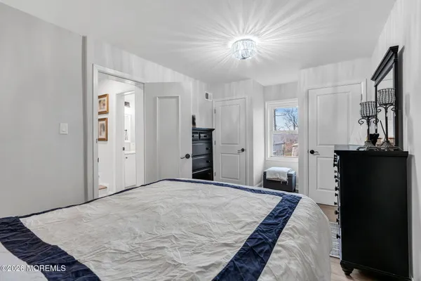 a bedroom with a bed and a television