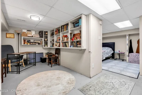 a bedroom with a bed and a couch