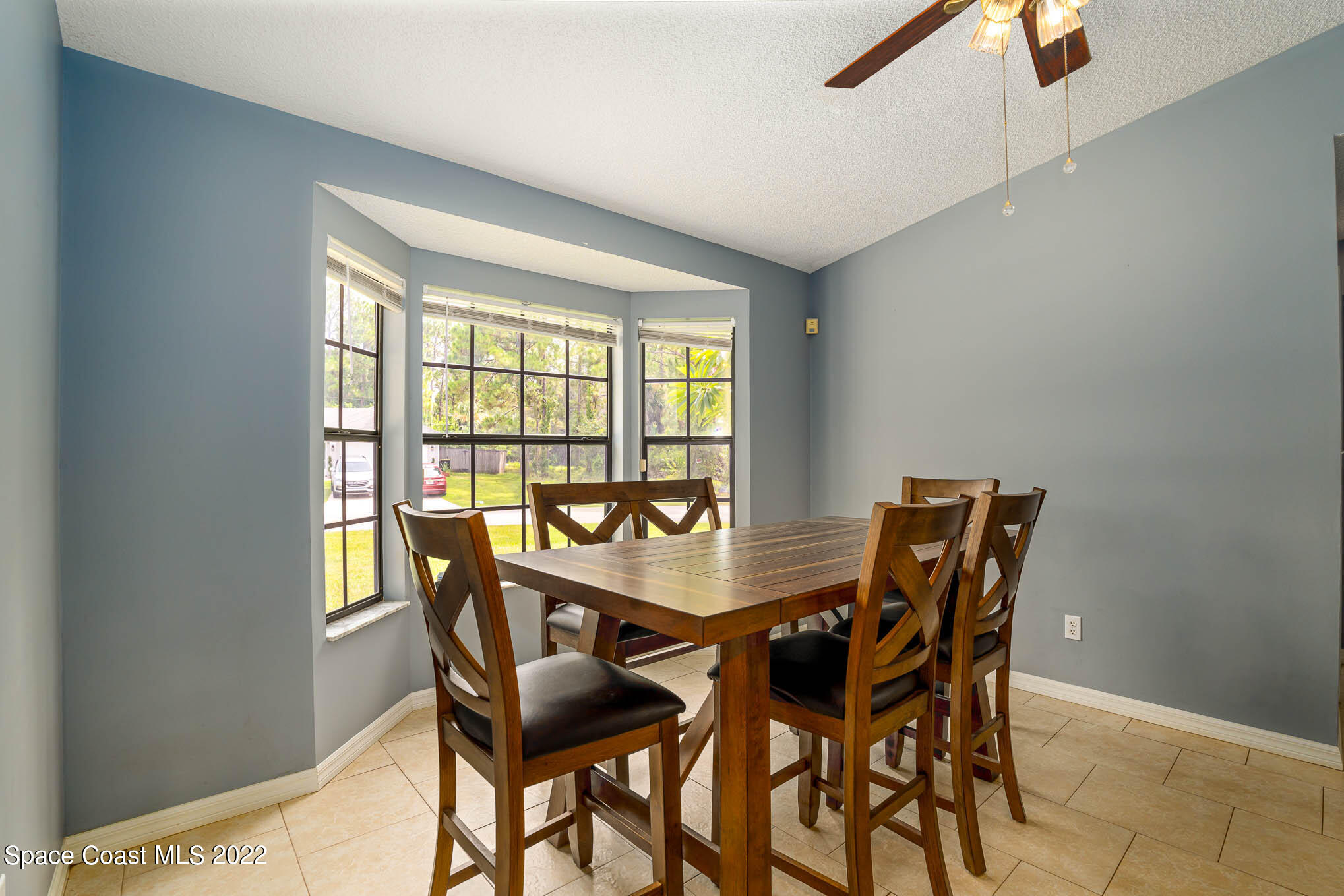 1291 Daton Road Southwest Palm Bay, FL 32908 - Photo 8 of 22 a dining room with furniture and window