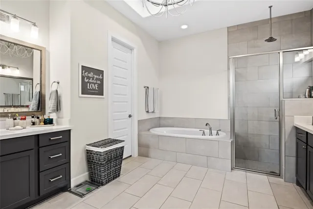 a bathroom with a tub sink toilet and mirror