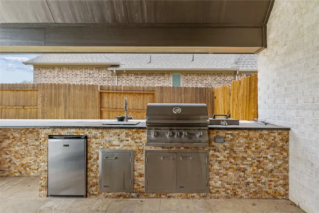 a kitchen with a stove and a refrigerator
