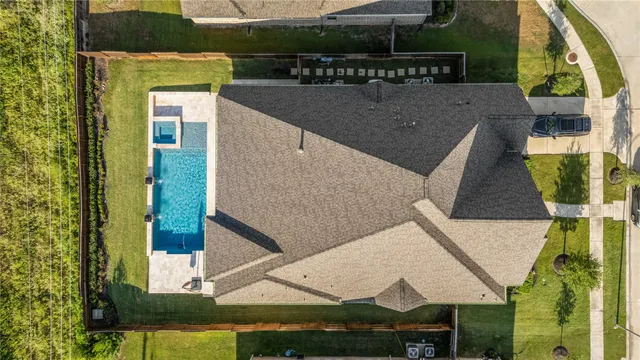 a large bathroom with a tub a double vanity sink a toilet a mirror and shower