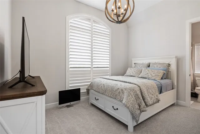 a bedroom with a bed and a closet